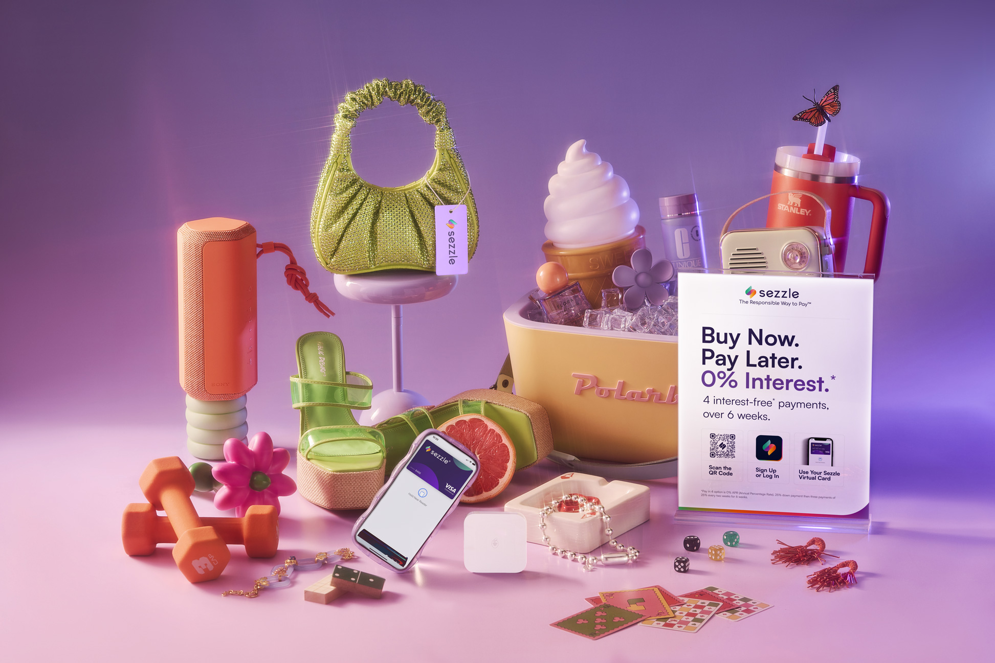 a spread of fashion goods along with a sign that says buy now pay later